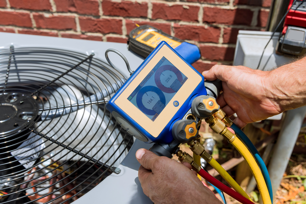 Palm City One of our AC technicians testing equipment in need of HVAC repair or service.